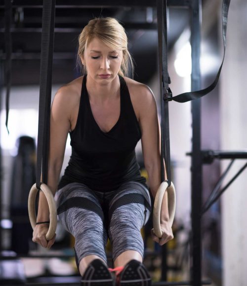 woman-working-out-pull-ups-with-gymnastic-rings-2021-08-26-15-57-37-utc.jpg